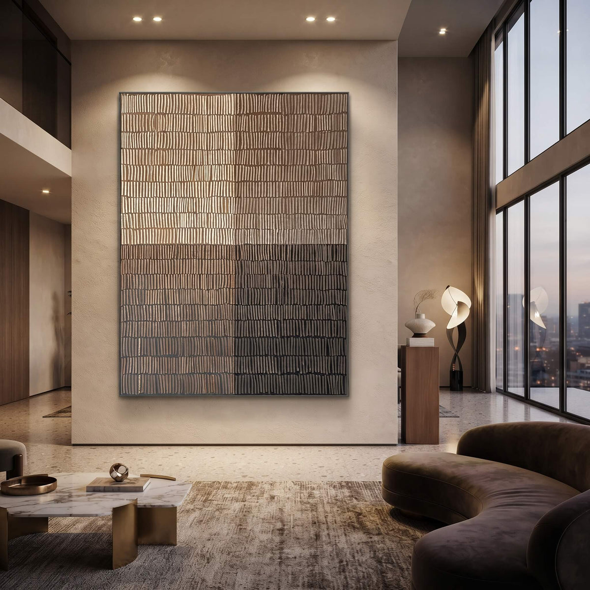 A large rectangular abstract wall art piece with a grid-like textured pattern in beige, gray, and brown tones, displayed in a modern living room setting with a curved sofa, coffee table, and tall windows.