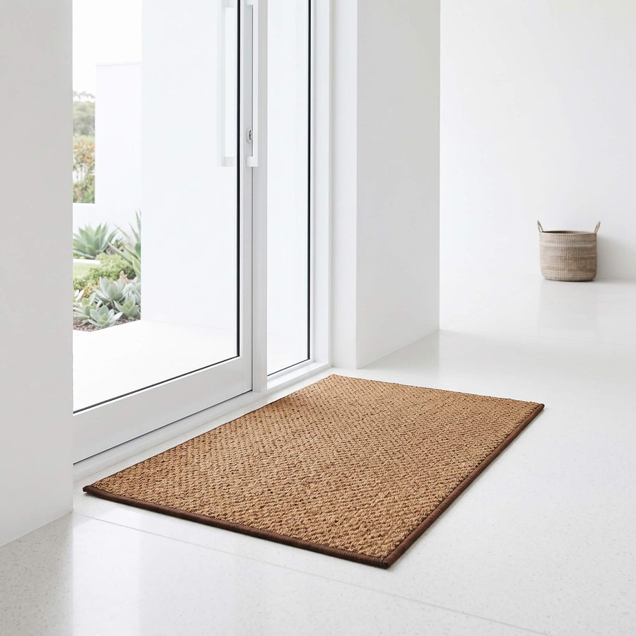 Coconut palm coir welcome mat in natural tone