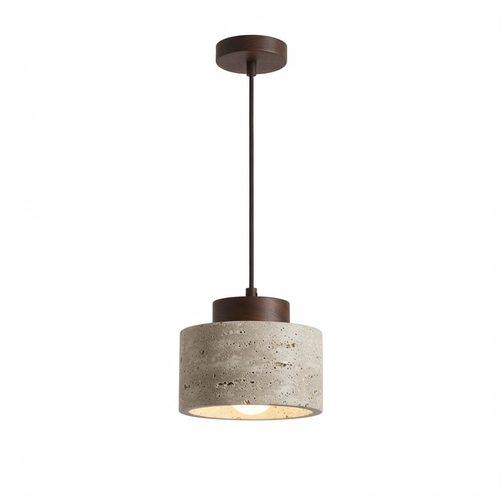 A modern pendant light with a textured concrete drum shade, a dark bronze metal top canopy and cord, and a warm glowing light visible from within the shade, shown against a plain white background.