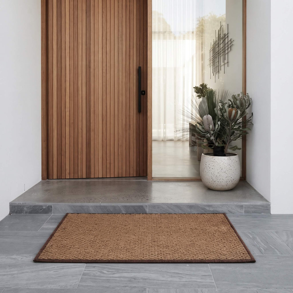Coconut coir welcome mat at a front entrance