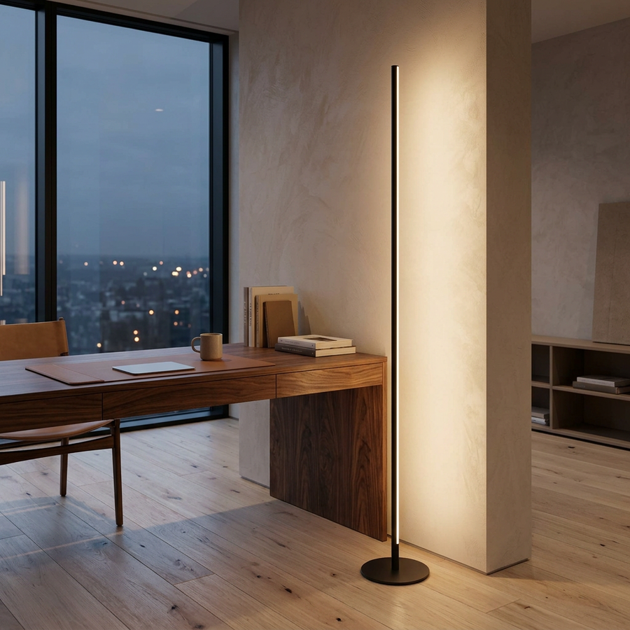 The Minimalist Linear Floor Lamp beside a walnut desk in a modern home office at dusk