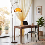 French Mushroom Arc Floor Lamp arcing over a sofa in a living room