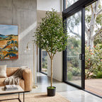 Realistic faux olive tree in a textured pot
