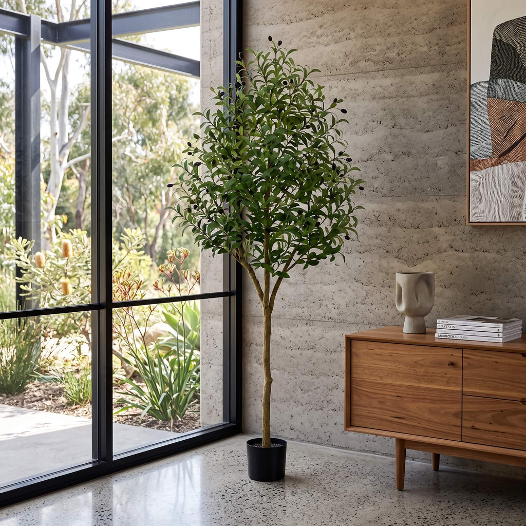 Large faux olive tree potted and styled