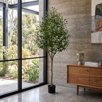 Large faux olive tree potted and styled