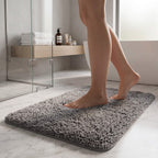 Bare feet stepping onto a plush non slip bath rug