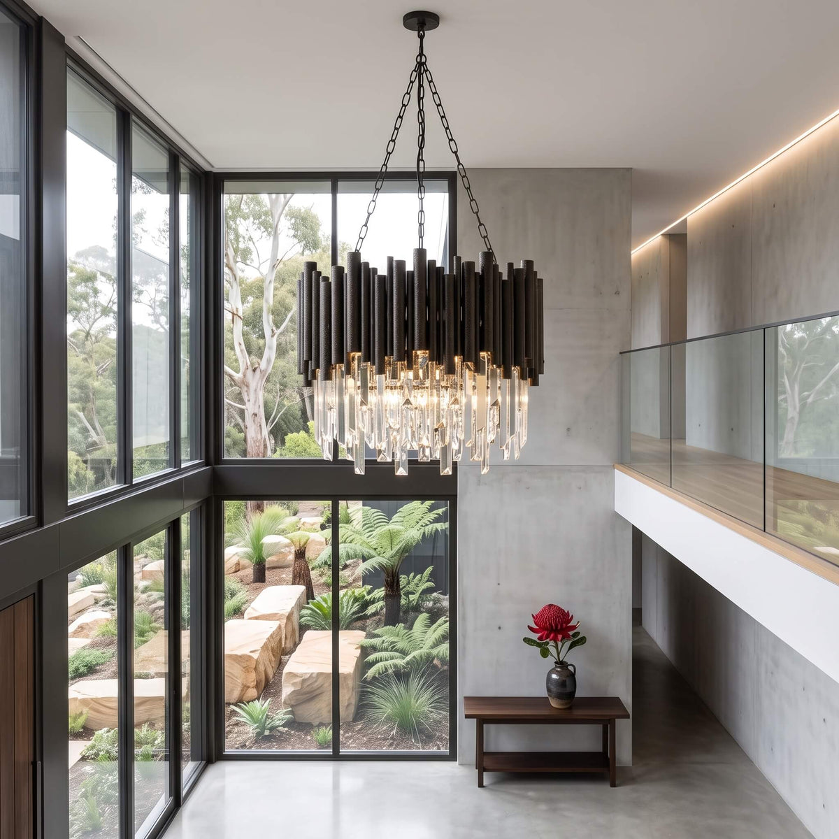 Black and crystal chandelier hanging in a double height entry