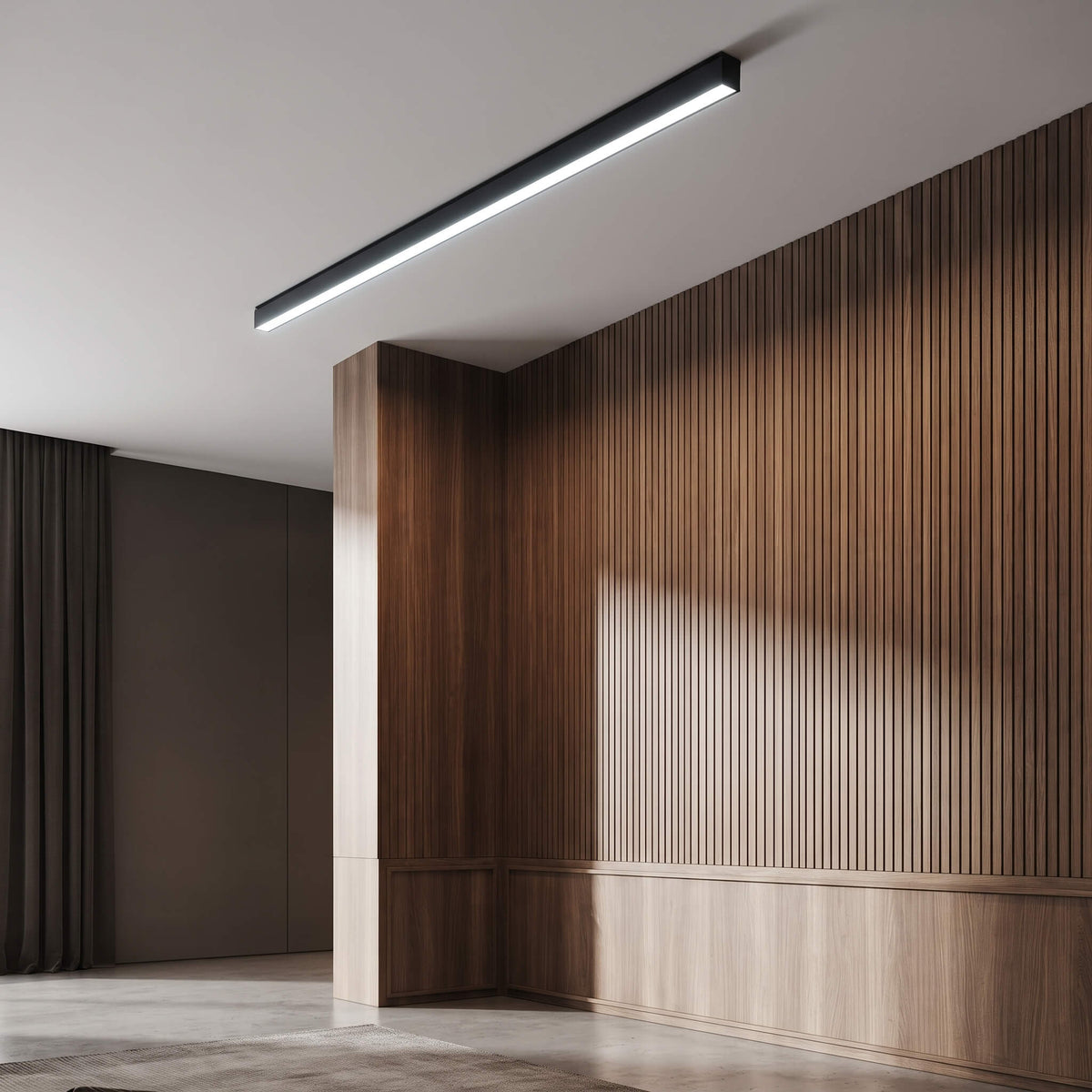 Minimalist linear LED ceiling light casting light down a hallway