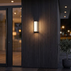 Close view of the black frame and opal diffuser on the Sentry motion sensor wall light