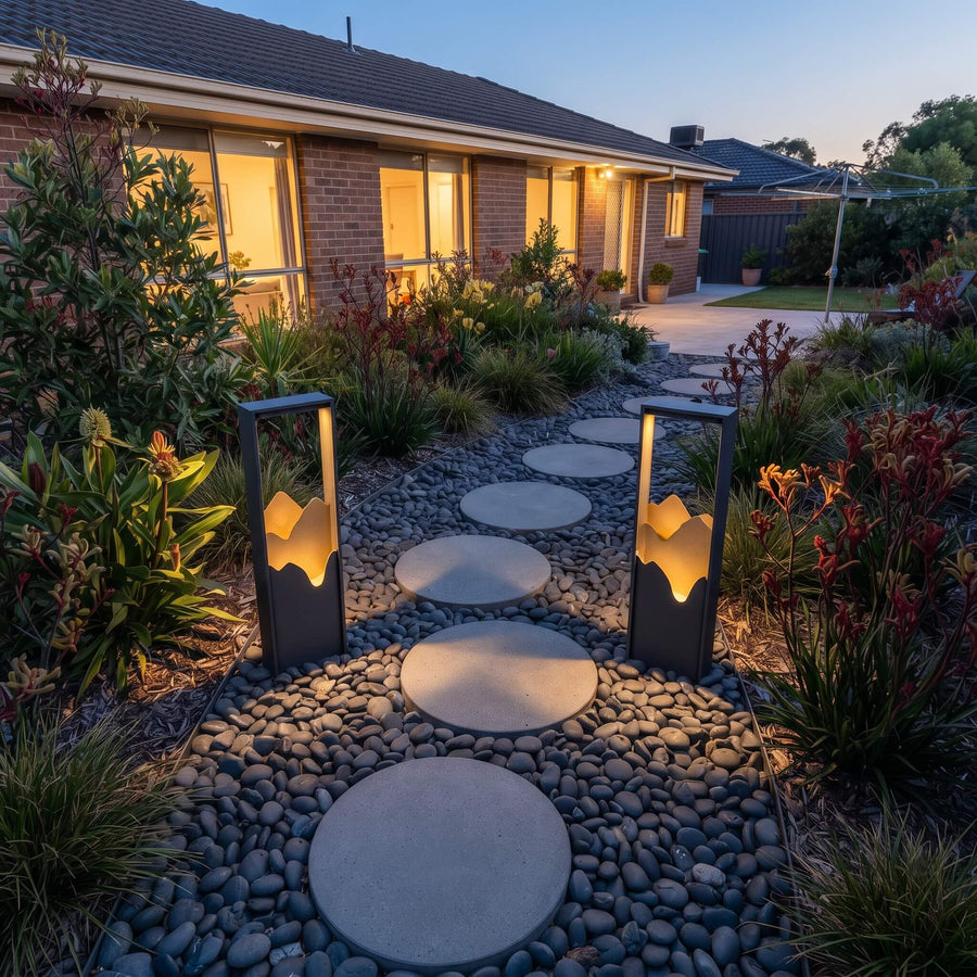 A run of Ridge bollard lights illuminating a garden path