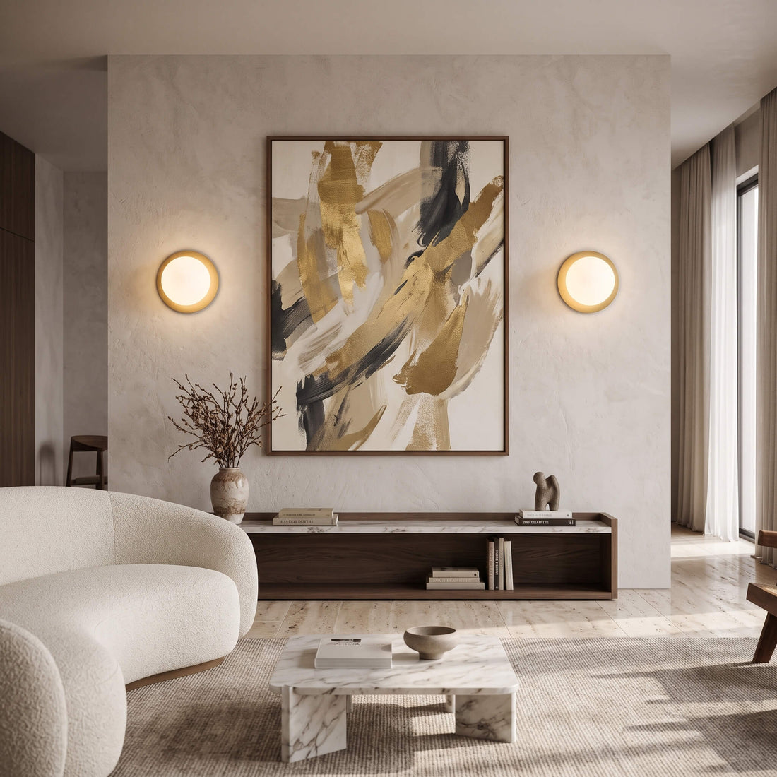 Brass globe wall sconces flanking artwork in a living room