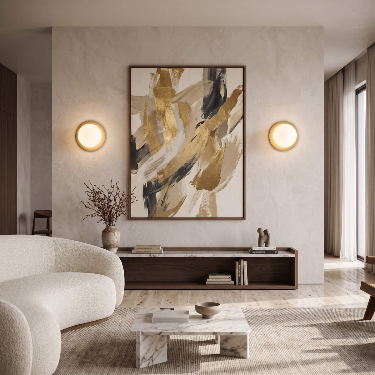 Brass globe wall sconces flanking artwork in a living room