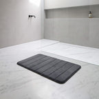 Dark grey memory foam bath mat showing the plush pile