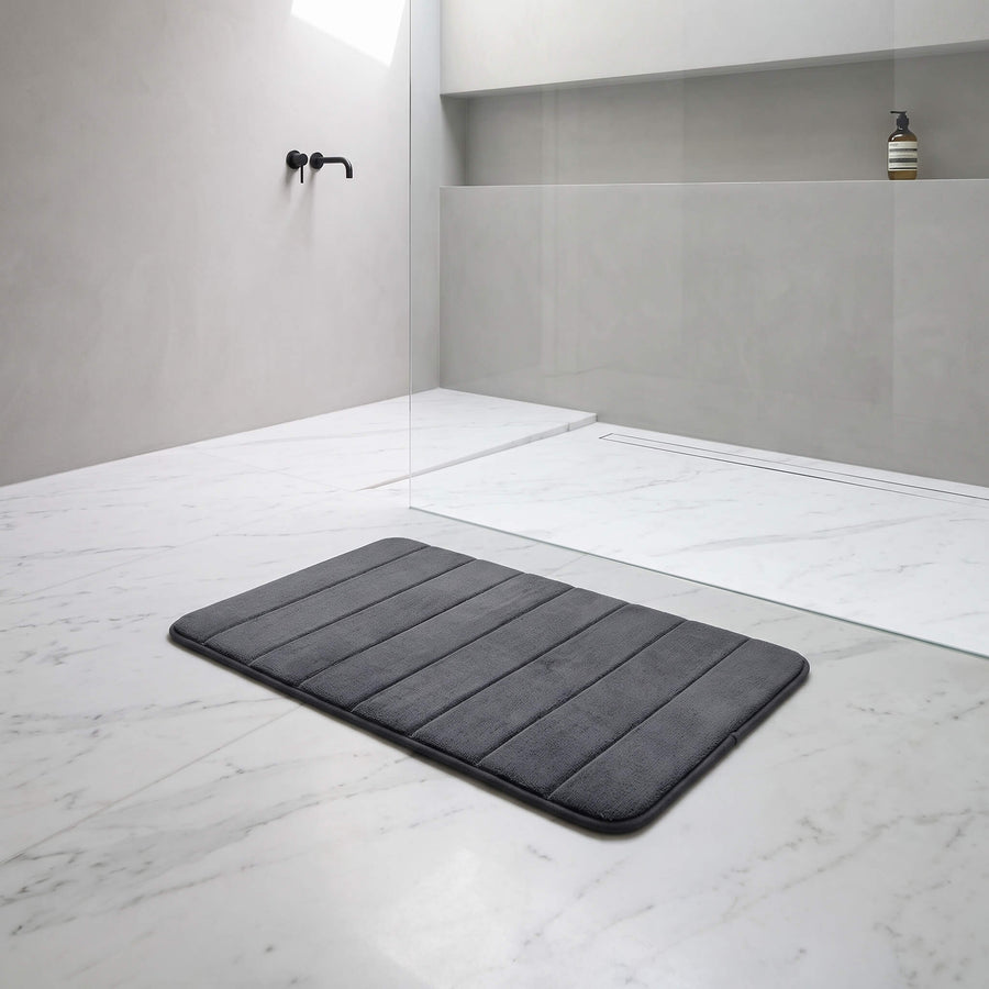 Dark grey memory foam bath mat showing the plush pile