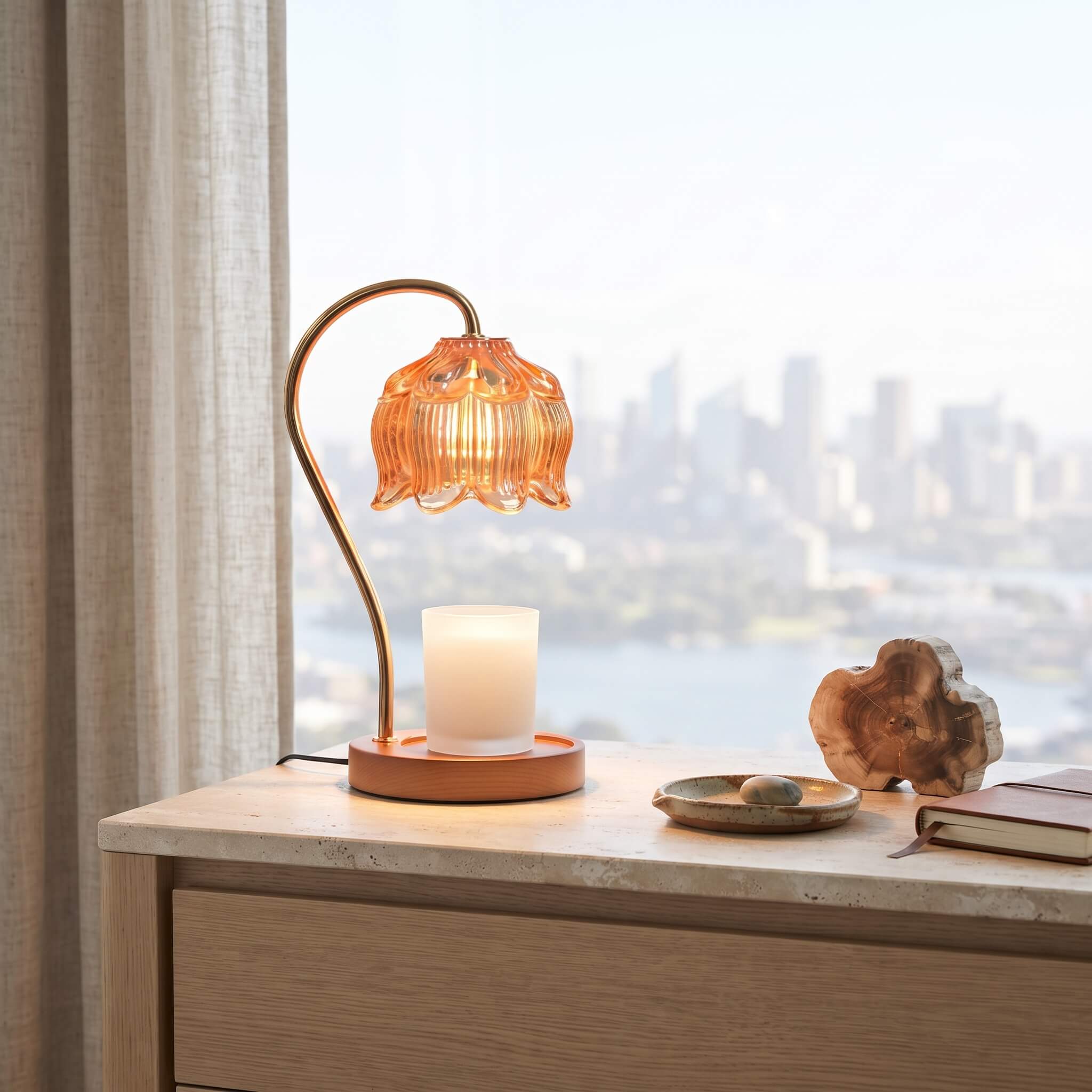 Amber glass candle warmer lamp illuminated with its dimmer set low