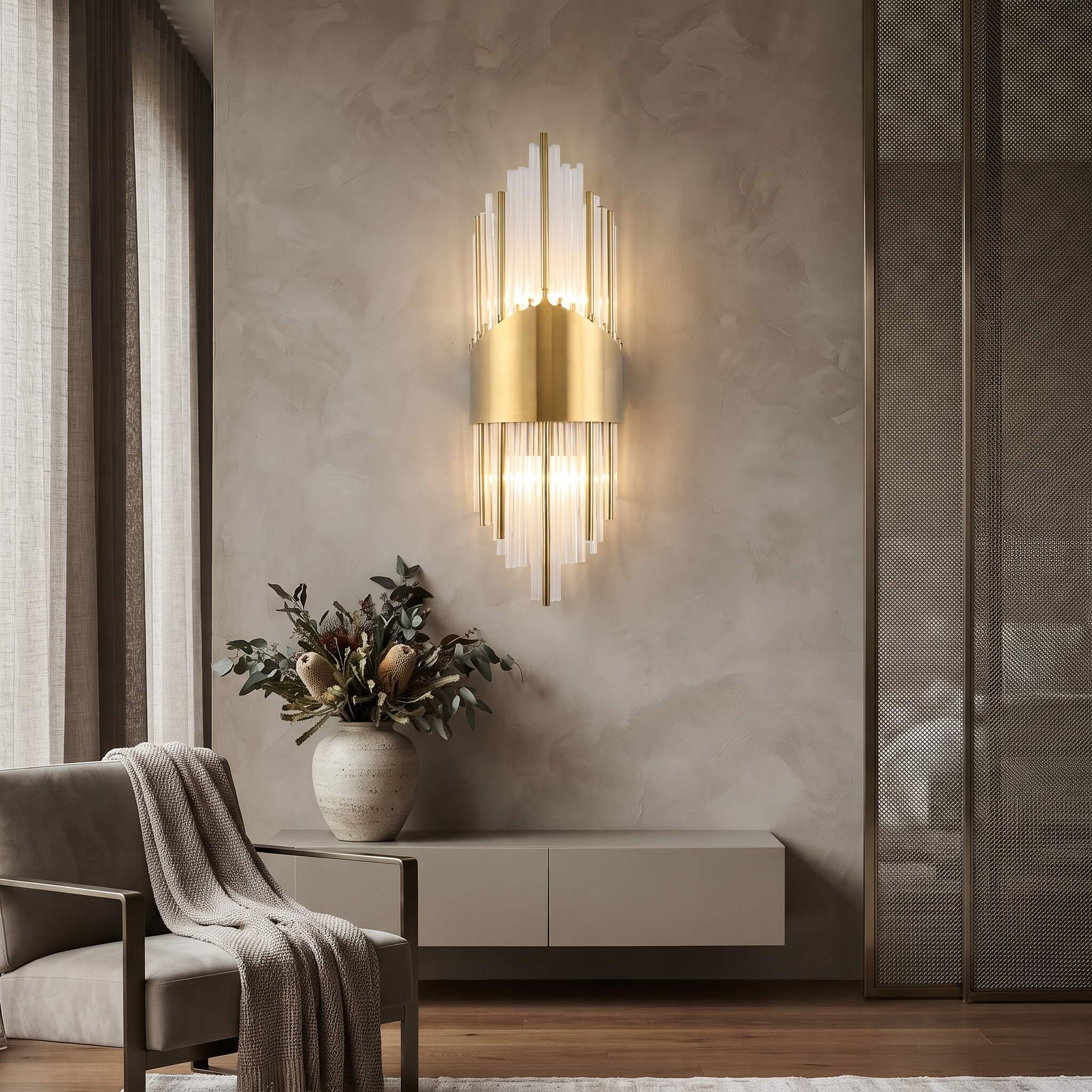 Art deco wall sconce above an entryway console with native flowers