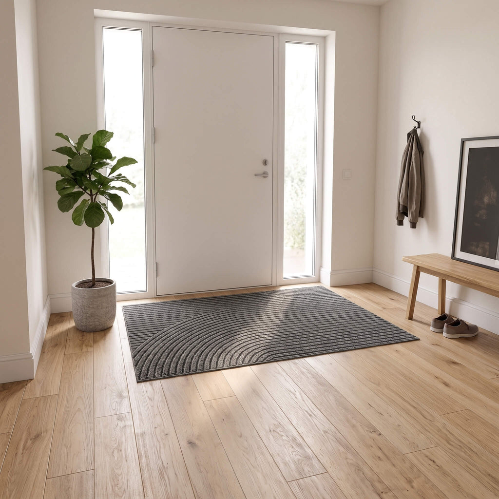 Grey ribbed door mat in an apartment entry