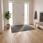 Grey ribbed door mat in an apartment entry