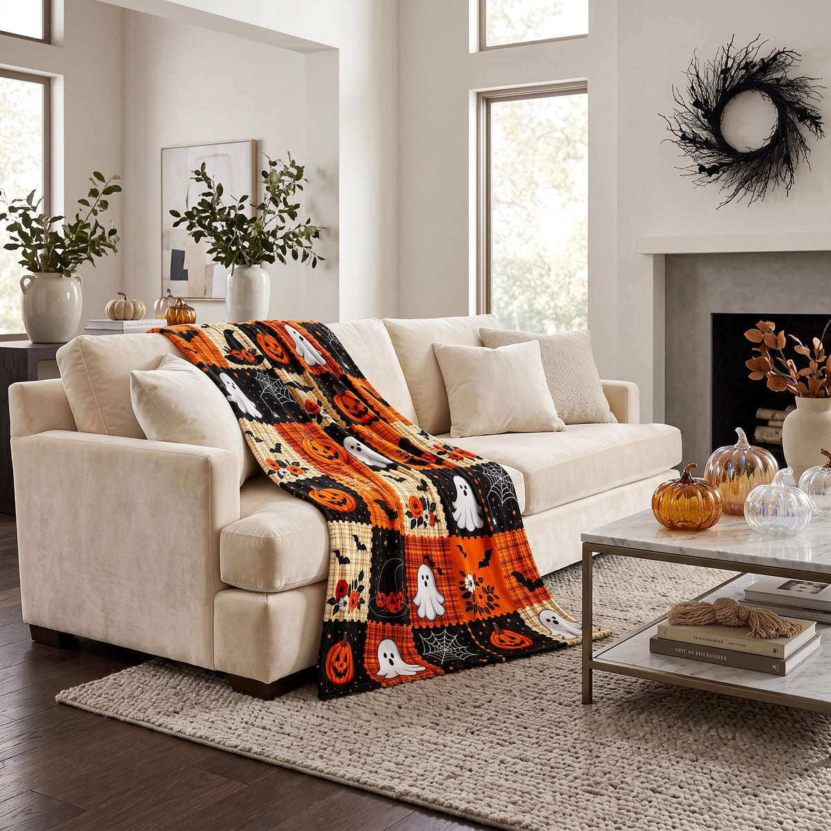 Halloween patchwork blanket across a cream sofa in a living room