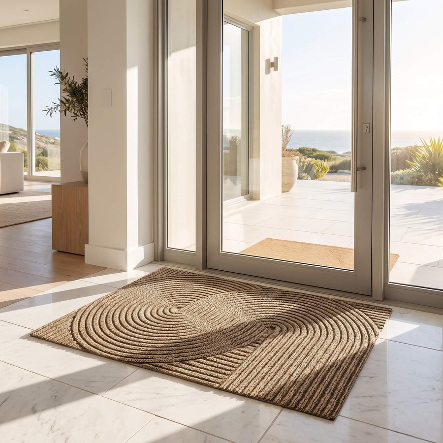 Khaki ribbed door mat lying flat at an open doorway