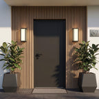 Sentry motion sensor wall light beside a minimalist residential doorway