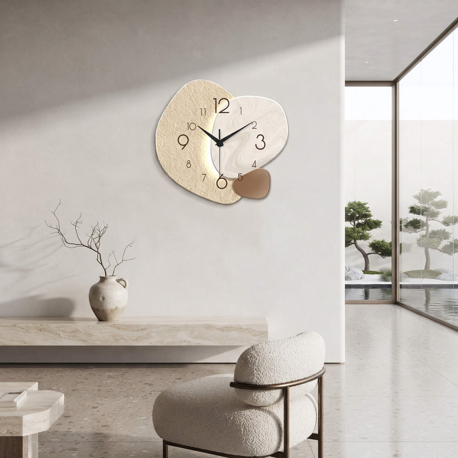 Silent abstract wall clock above a console table in a hallway