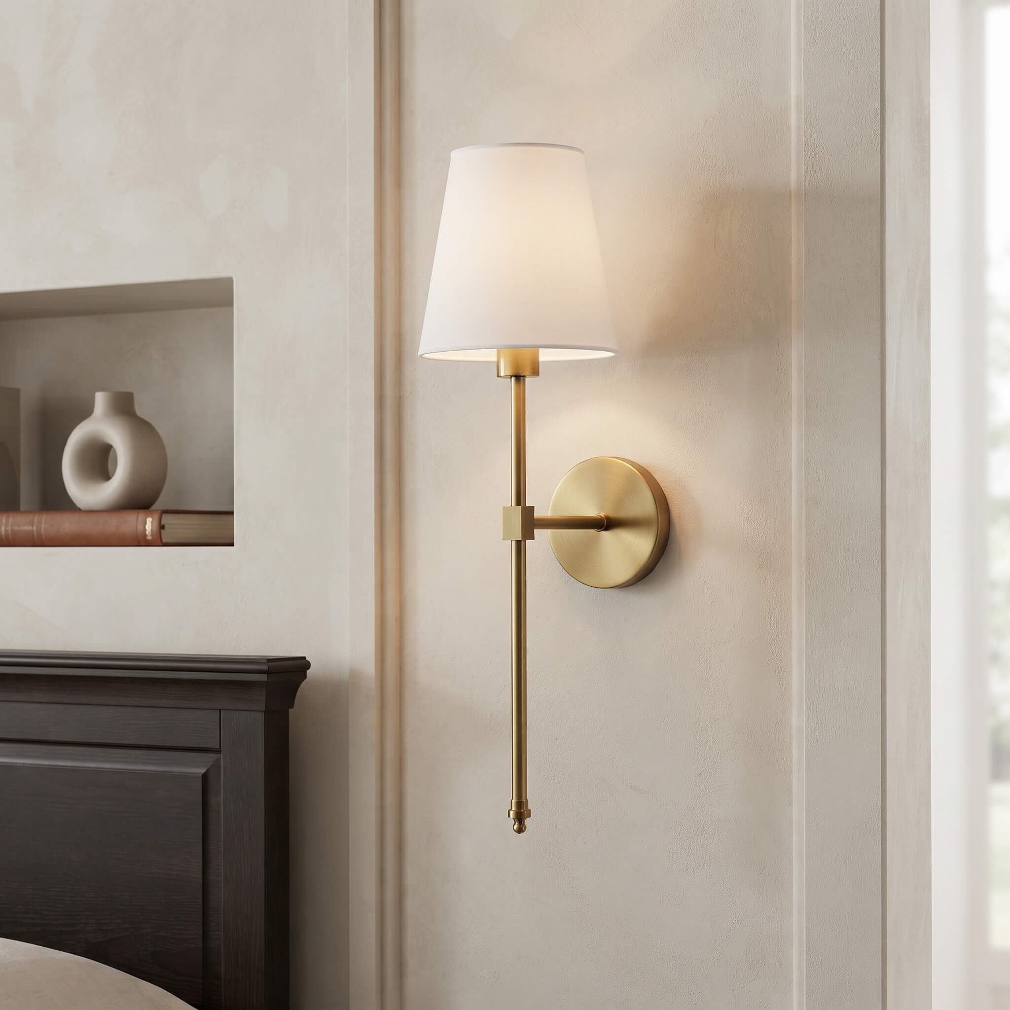 Close view of the tapered fabric shade and brass finish stem