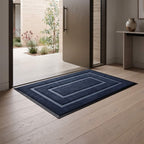 Navy blue non slip door mat lying flat on the floor