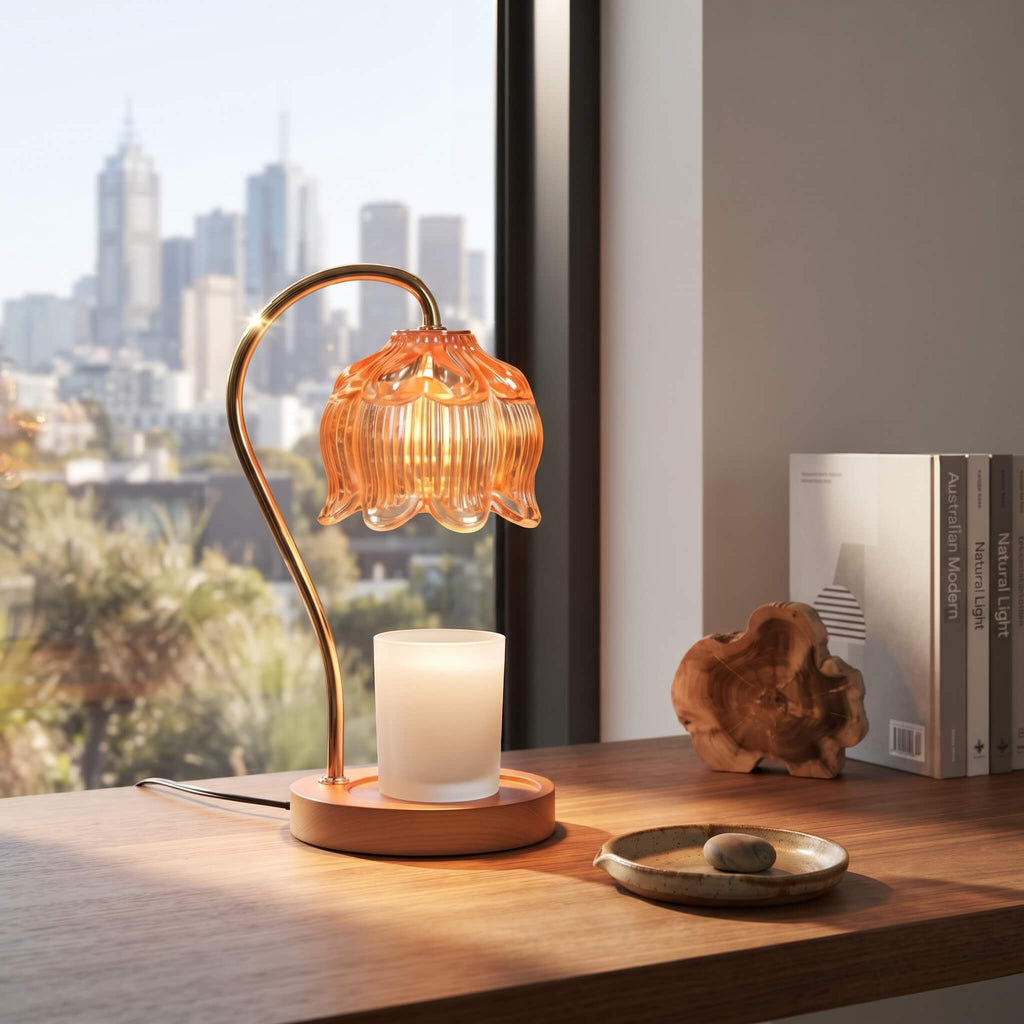 Amber glass candle warmer lamp warming a candle from above