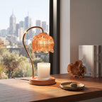 Amber glass candle warmer lamp warming a candle from above