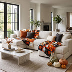 Halloween patchwork blanket spread across a large sectional sofa