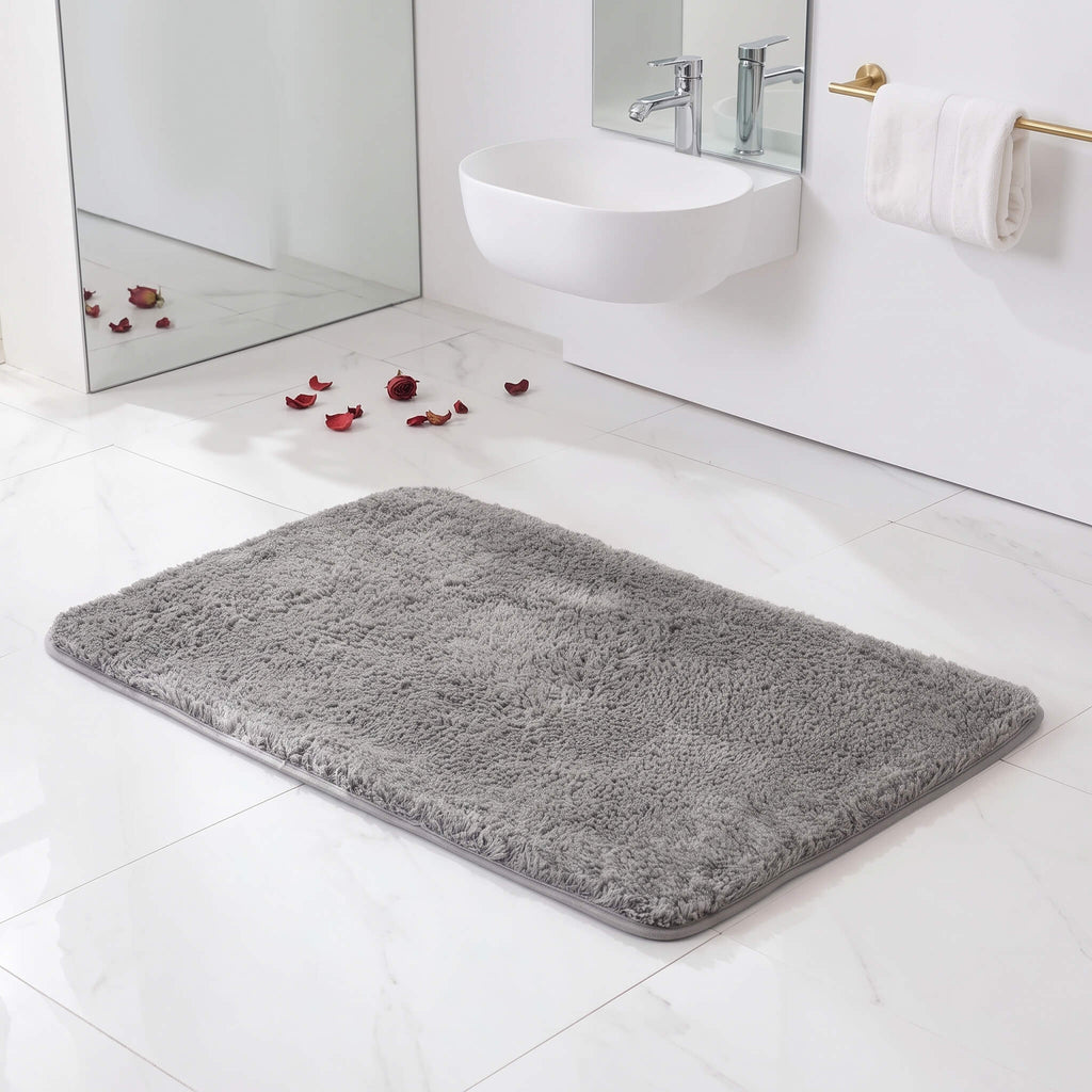 Deep plush pile of the grey bath rug up close