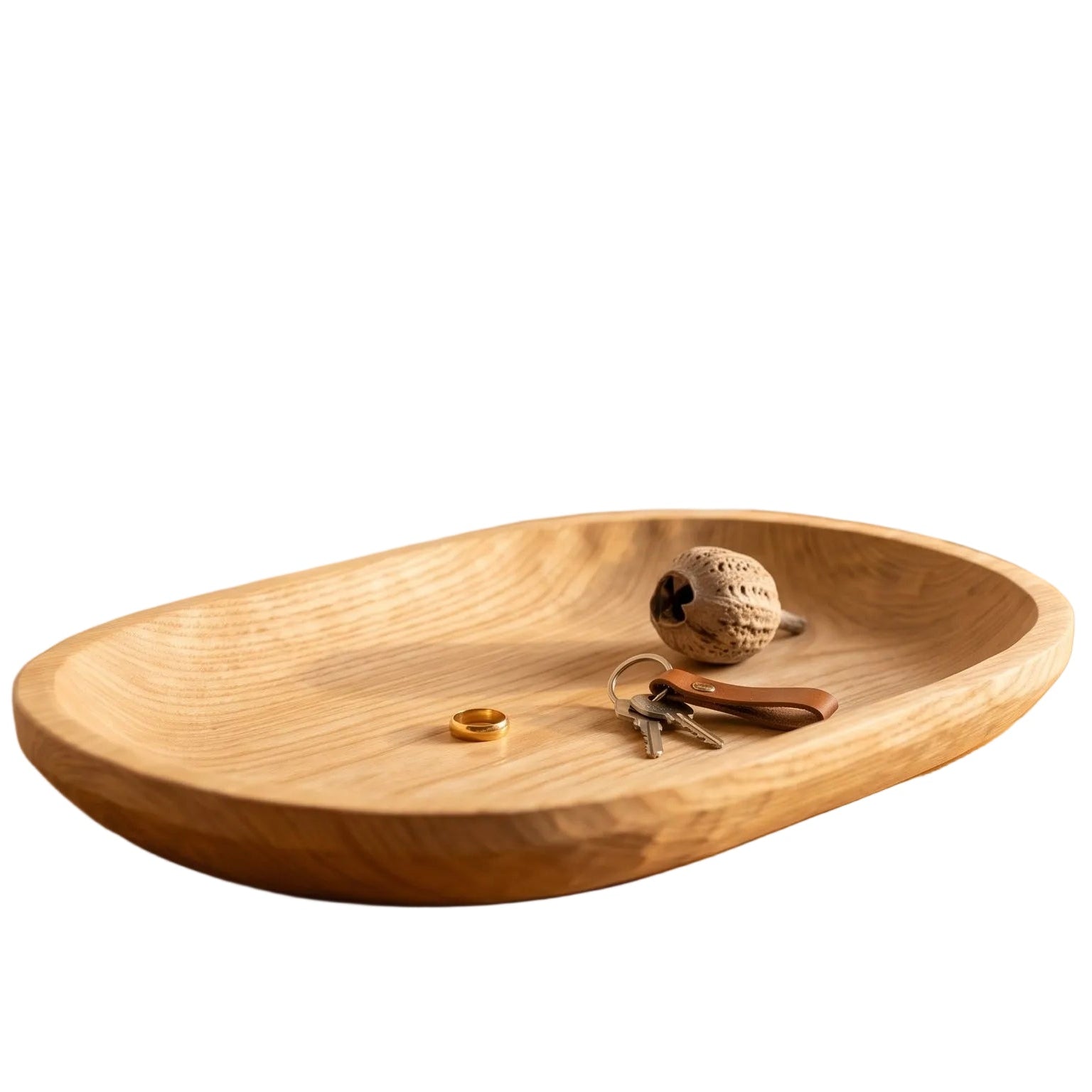 Wooden tray on a wooden surface with decorative items, plants, and a vase in the background.