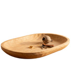 Wooden tray with a small ball and keys on a white background