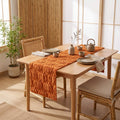 Caramel tufted pumpkin table runner on a timber dining table