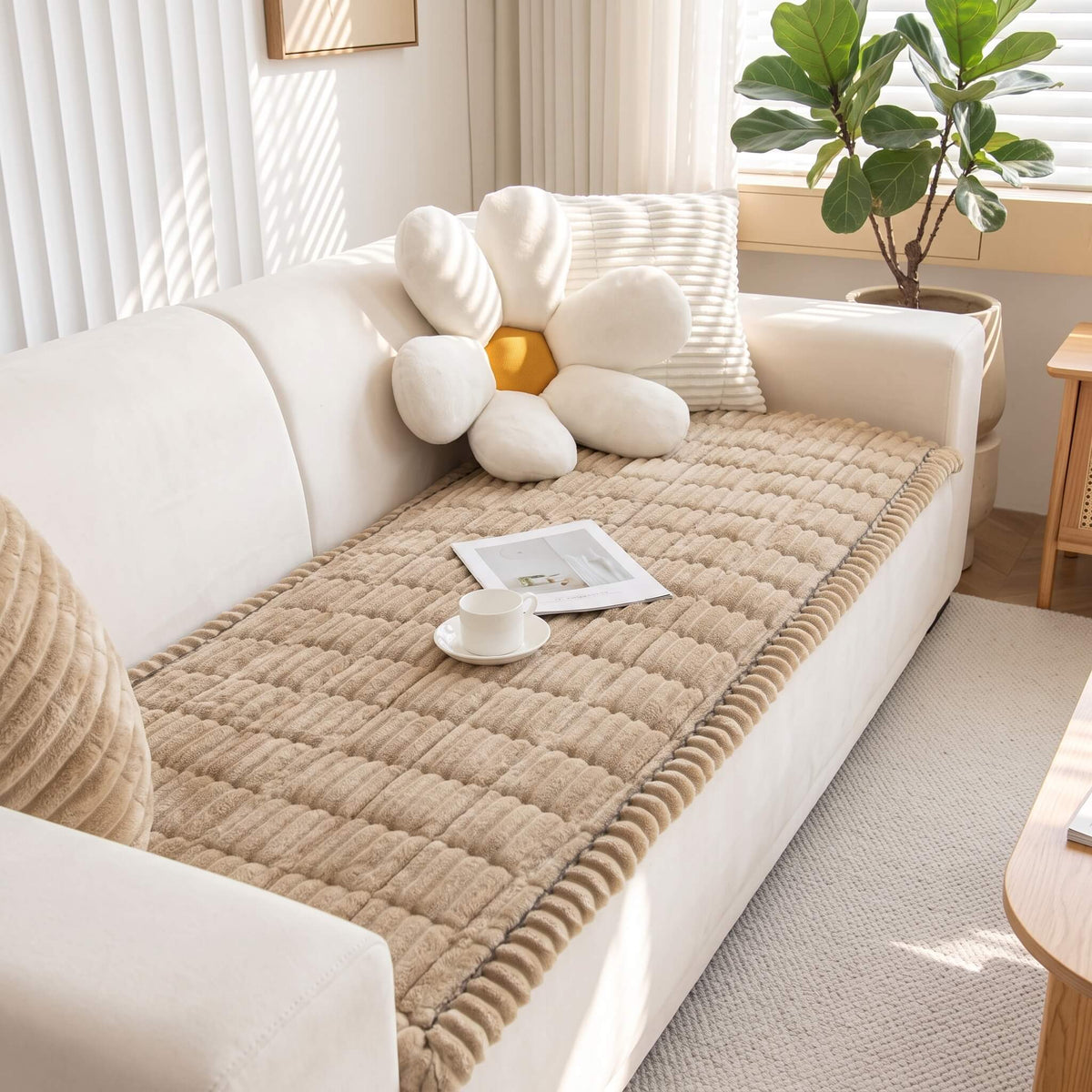 Quilted beige sofa cover showing the stitched panels