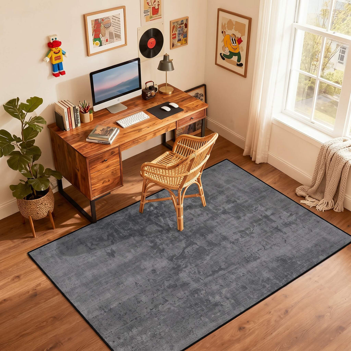 Grey non slip flat pile area rug under a desk and chair