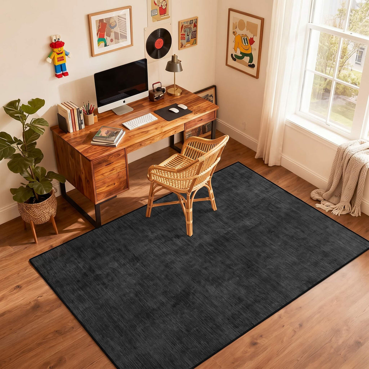 Black non slip flat pile area rug in a home office