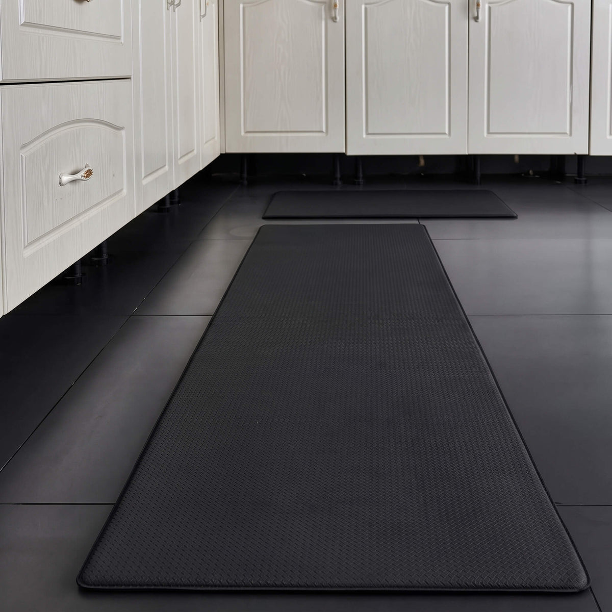 Black anti fatigue kitchen mat with anti slip texture
