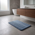 Slate blue memory foam bath mat in an ensuite