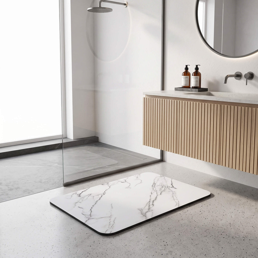 Quick dry bath mat lying flat on a tiled floor