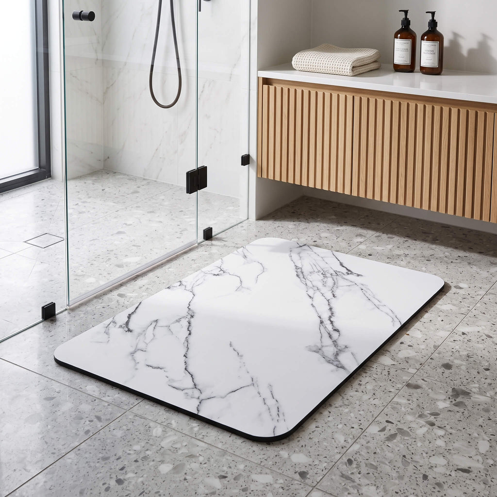 Quick dry stone look bath mat on a bathroom floor