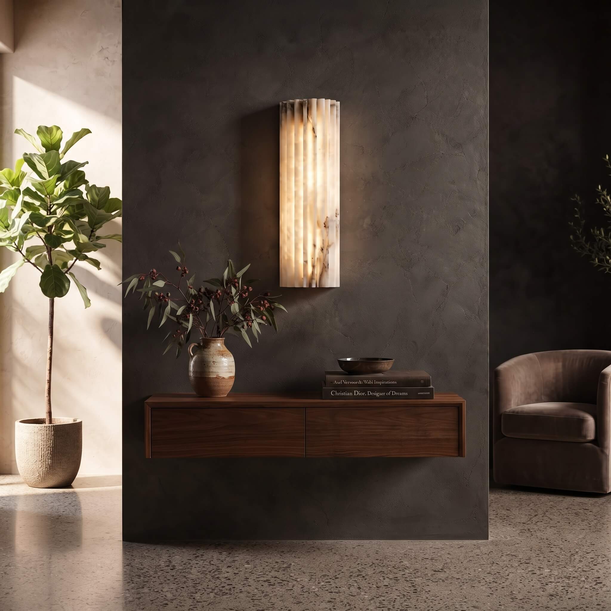 Alabaster wall sconce above a floating walnut console in an entryway
