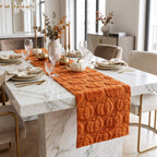 Pumpkin table runner on a marble dining table