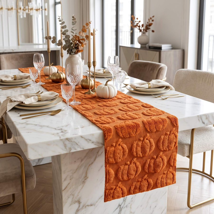 Pumpkin table runner on a marble dining table