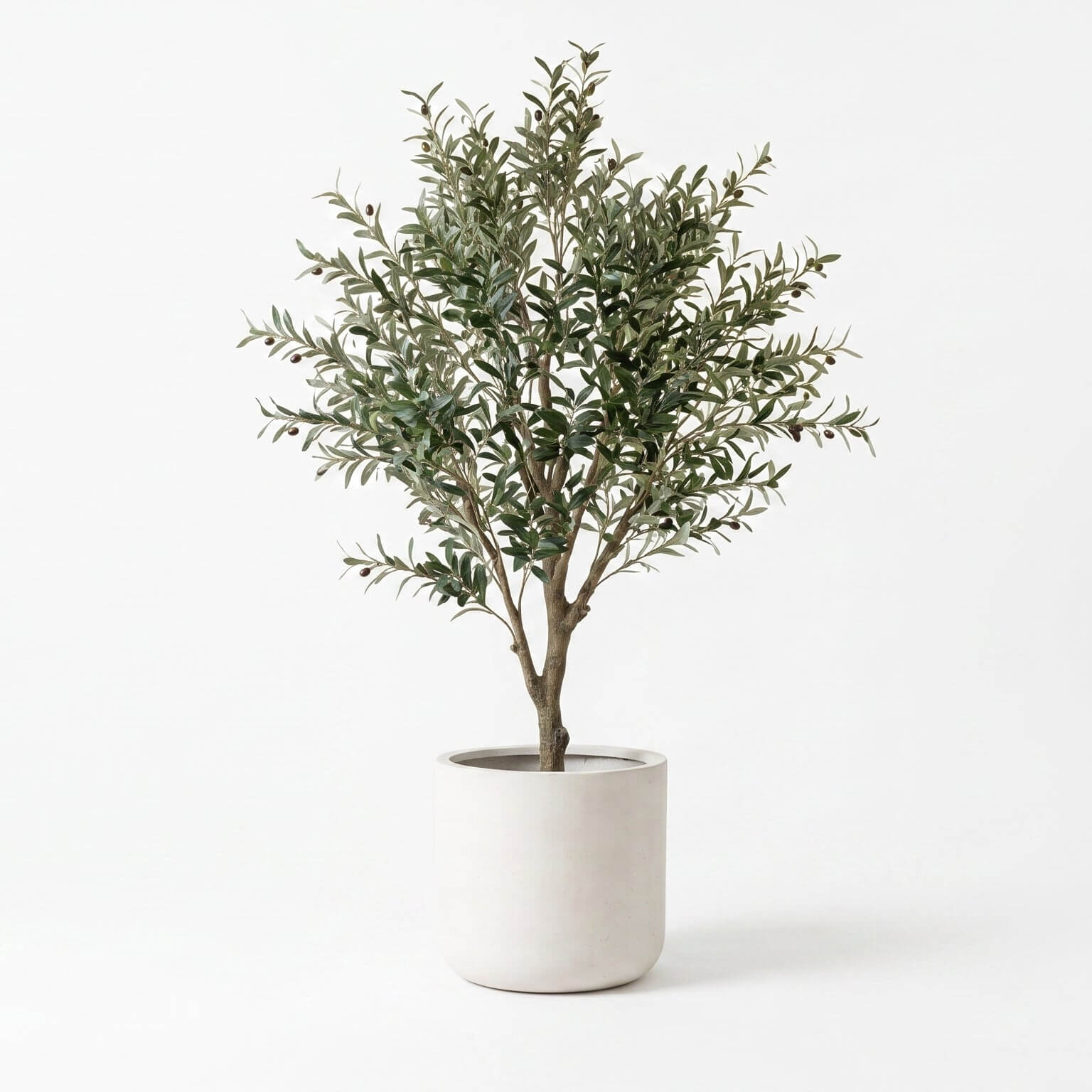 An artificial olive tree with dense, silvery-green leaves and brown branches, potted in a minimalist white cylindrical planter against a clean white background.