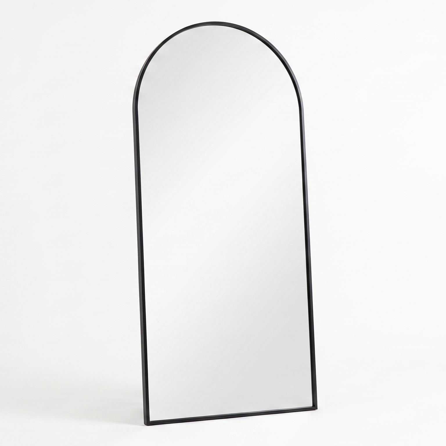 Arched mirror with black frame on a white background