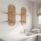 Two light natural wood wall-mounted shelves with an arched ribbed design, shown installed on a bathroom wall above a white sink.