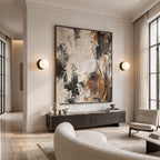 Globe wall sconces either side of abstract art in a living room