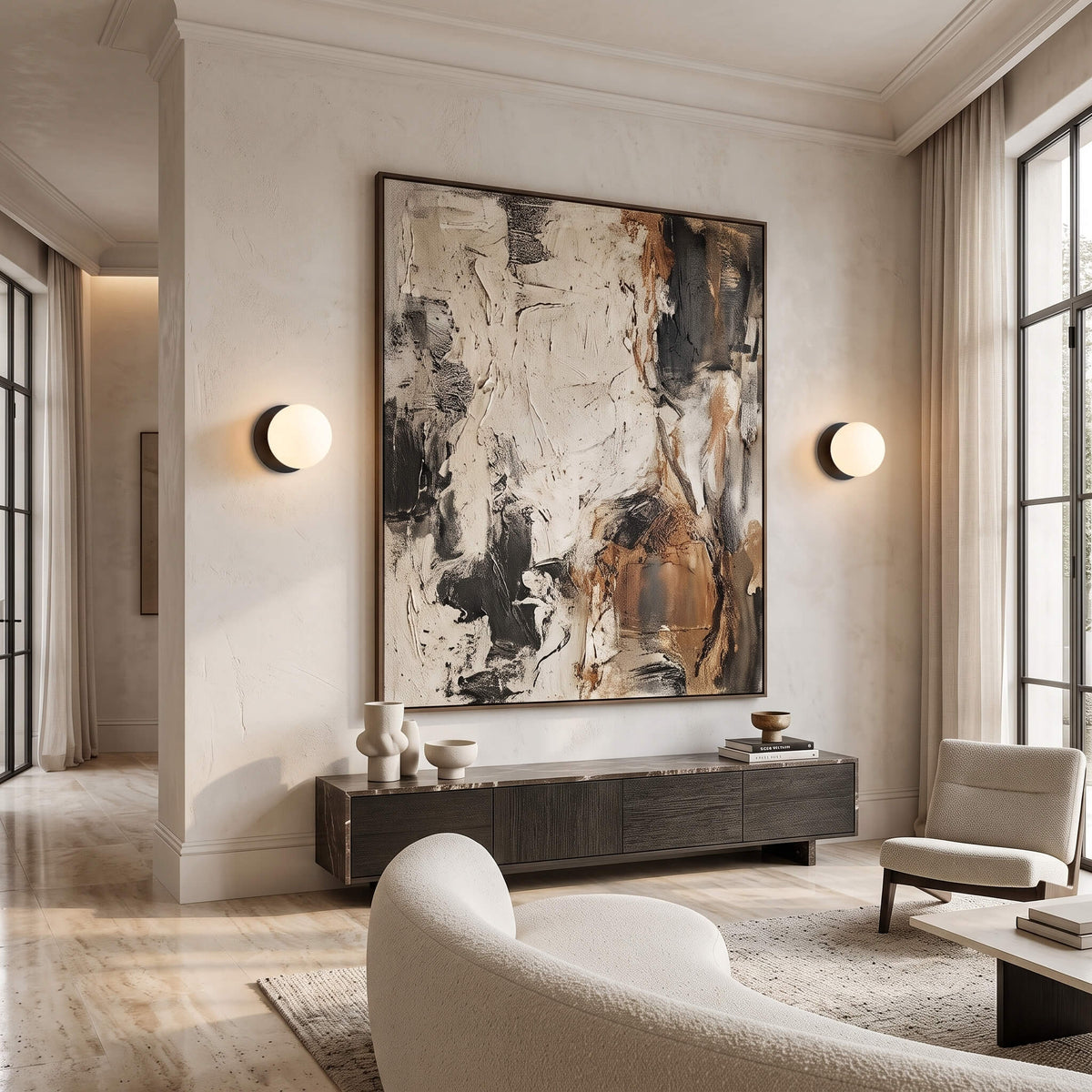 Globe wall sconces either side of abstract art in a living room